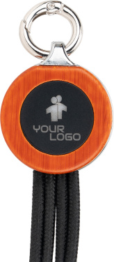 Logotrade Werbegeschenke das Foto: 4-in-1-Kabel mit elighted-Logo im Holzgehäuse
